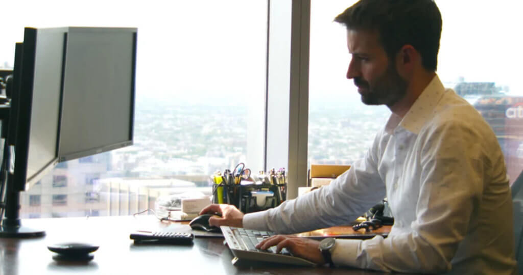 Justin Hance- Portfolio Manager- working at his desk